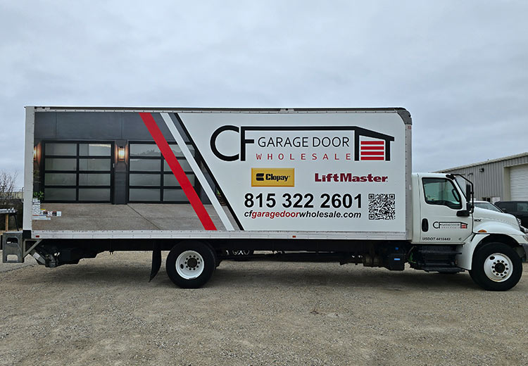 A long box truck with a commercial wrap